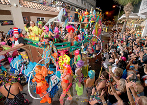 Fantasy Fest Parade’s elaborately costumed groups, dancers in bright feathered costumes and dazzling floats. 